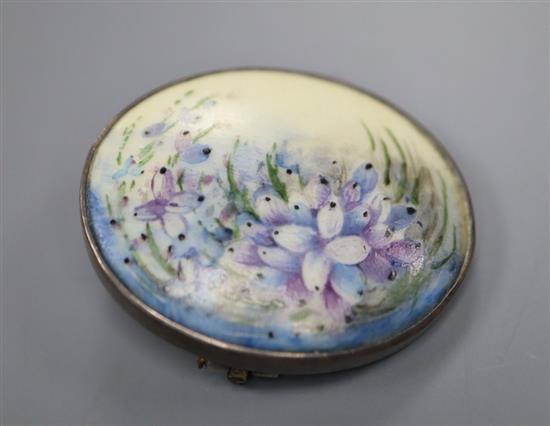 An early 20th century sterling and porcelain oval brooch, decorated with flowers, 31mm.